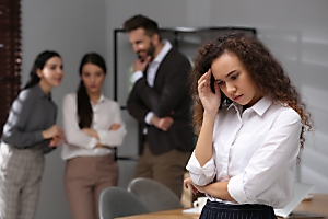 co workers talking about another employee