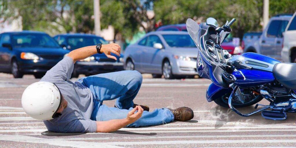 motorcycle wreck in busy intersection
