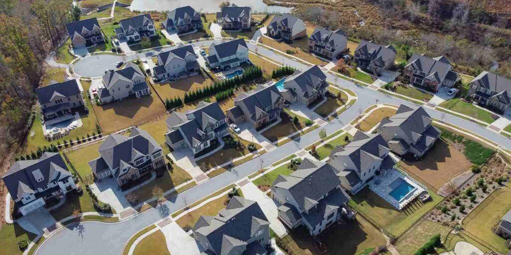 CA peaceful subdivision neighborhood row of new development two story house with swimming pool and well trimmed yards suburbs