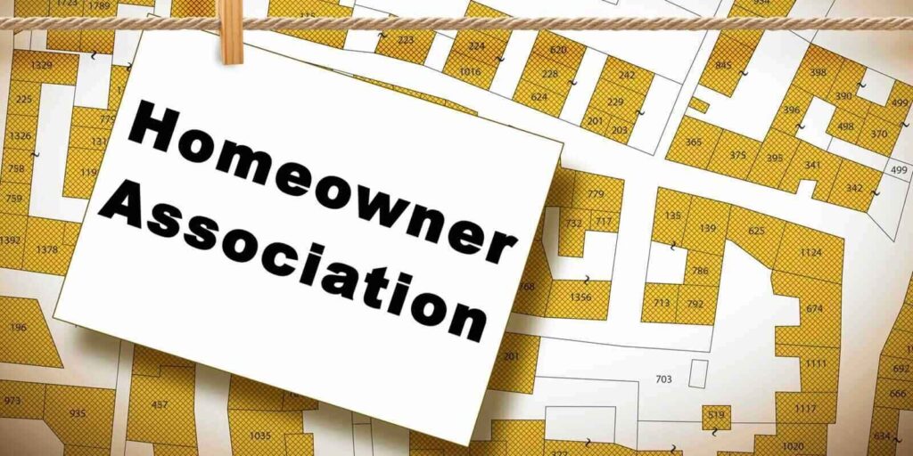 California homeowner association concept with residential homes models against an imaginary city map and text with copy space