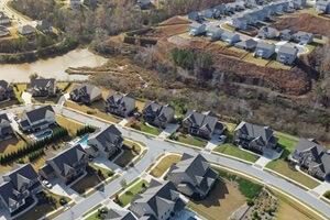 urban sprawl and master planning subdivision with row of new development two story houses