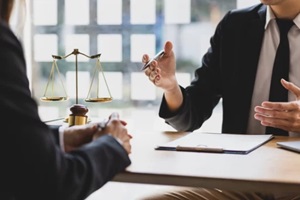 California HOA special assessments lawyer discussing case with client